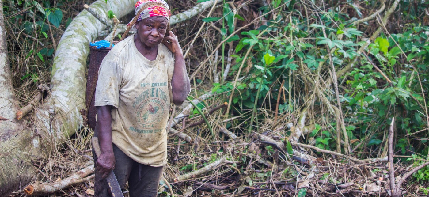 Woman with a machete in the jungle