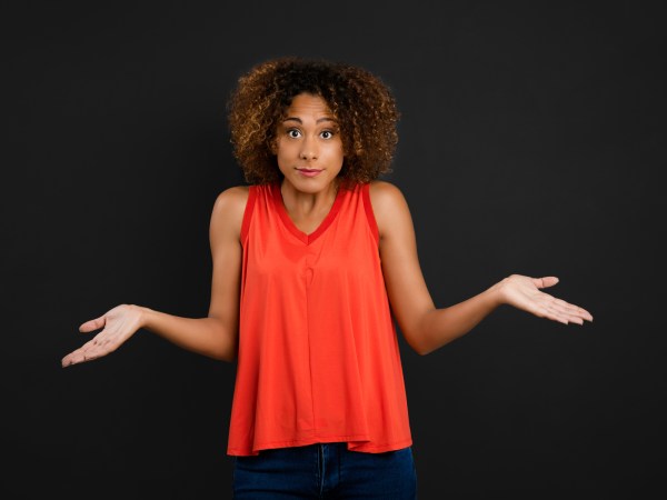 Woman shrugging expressively
