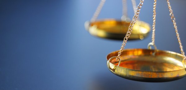 Jewelry scales against a blue background